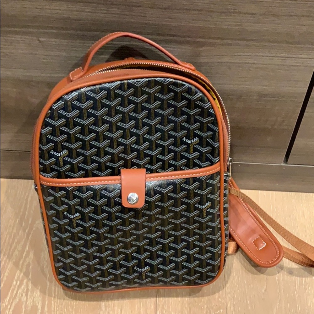 Tan and black backpack
